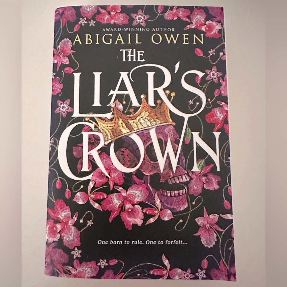 Signed, The Liar’s Crown, One born to rule. One to forfeit… By: Abigail Owen